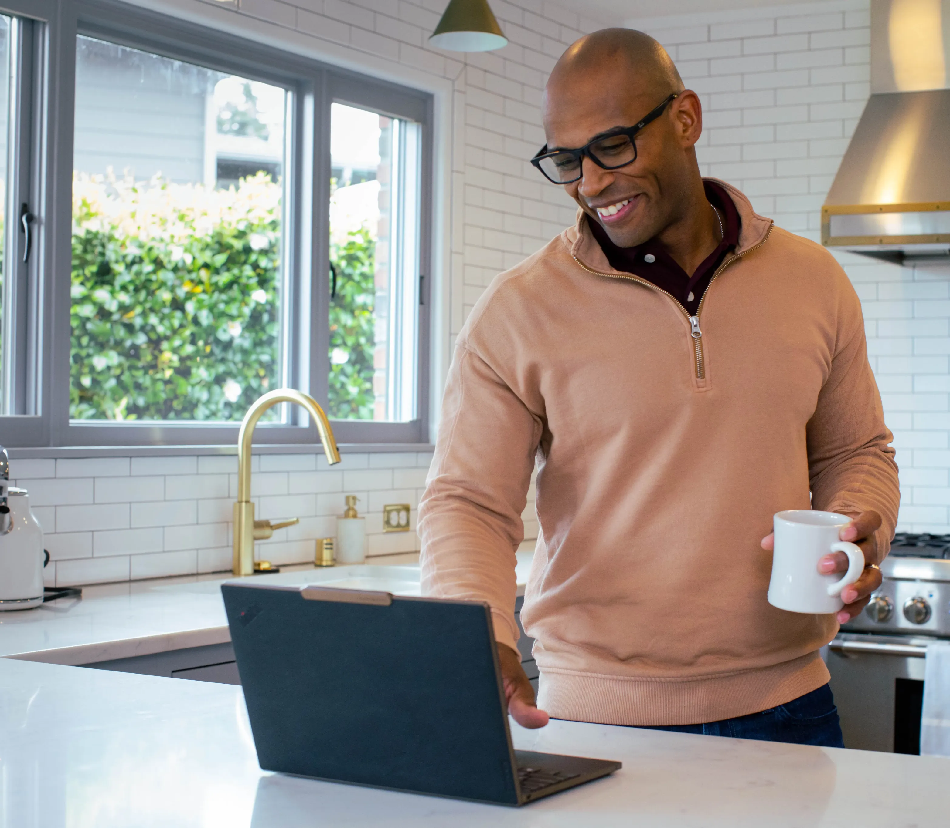 man looking at a laptop